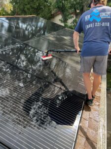 New Concept Employee Cleaning Solar Panel